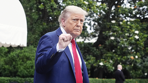 President Donald Trump walks to board Marine One after speakiing with reporters to depart the White House on his way to attend the G7 Summit in Canada, Sunday, June 15, 2025, in Washington. (AP Photo/Manuel Balce Ceneta)