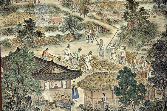 김학수의 '농가월령도' 중 5월. 타작 도구인 도리깨와 갈퀴로 보리를 타작하는 농부들의 모습이 보인다. 
