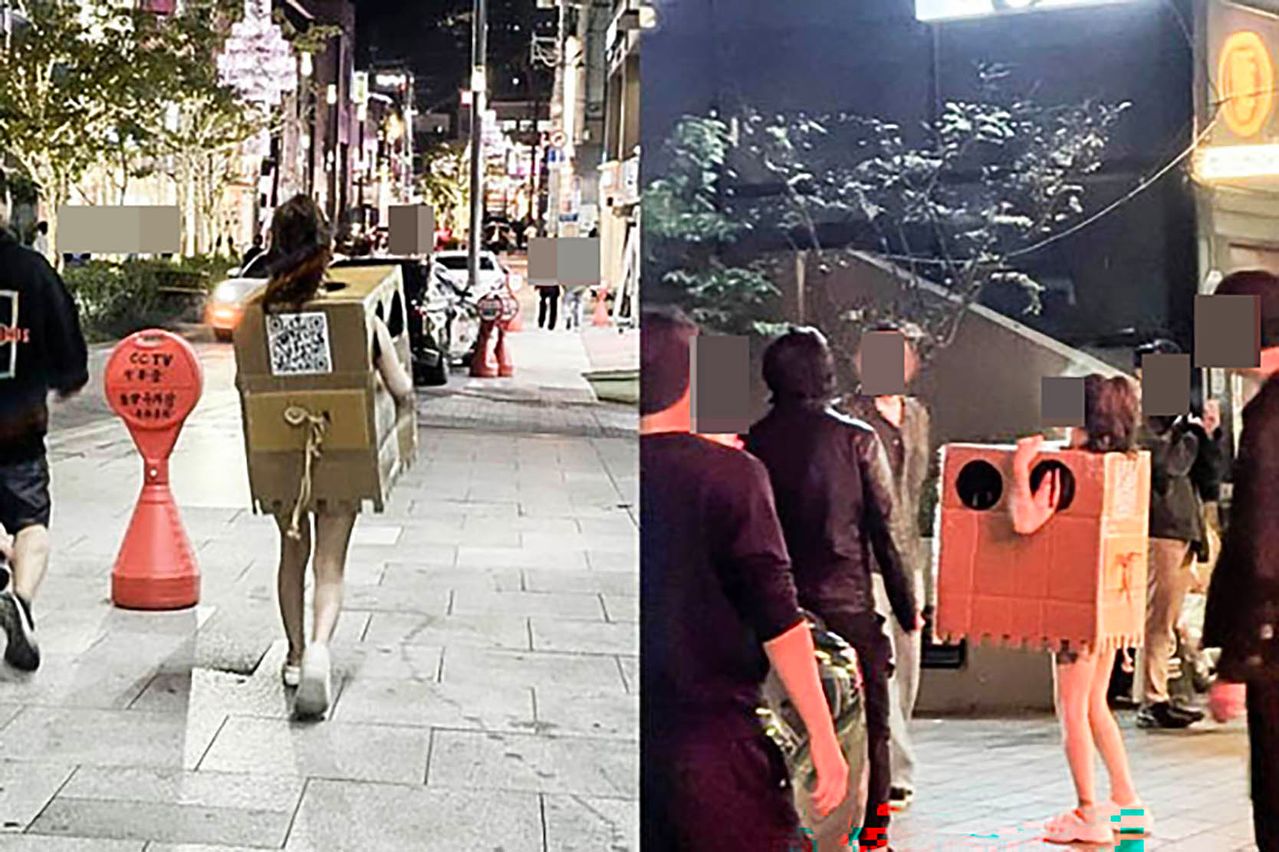 서울 압구정, 홍대 등 번화가에서 알몸에 박스만 걸친 채 길거리를 활보하며 자신의 신체를 만지라고 권한 여성. 사진은 서울 압구정동에서 포착된 이 여성의 모습. 사진 온라인 커뮤니티 캡처