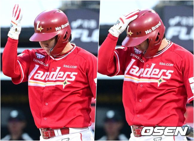 2볼 노스트라이크 상황에서 낮은 직구에 헛스윙 한 최정. 손바닥으로 헬멧을 때리며 아쉬워하고 있다.