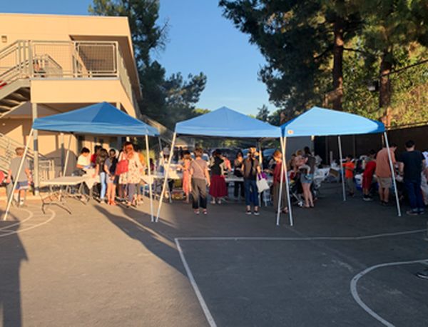 Exciting game booths at the Mountain Avenue Elementary School  Halloween Carnival, and the many students enjoying them.
