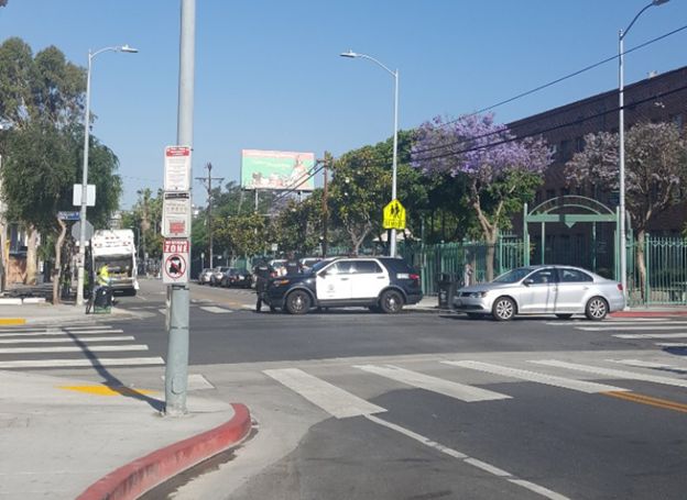 To the left, a huge clean-up truck to get rid of all the trash left behind. To the right, a police car guarding the street, during the whole process nearby Larchmont Charter. Source: Author, Joanne Chae